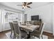 Elegant dining room with a large wooden table, seating for six, and white wood-paneled walls at 4531 7Th N Ave, St Petersburg, FL 33713