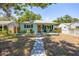 Charming single-story home featuring a well-manicured lawn, fresh paint, and a welcoming front porch at 4531 7Th N Ave, St Petersburg, FL 33713