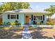 Charming single-story home with a walkway leading to the front door and an ADT security system sign on the lawn at 4531 7Th N Ave, St Petersburg, FL 33713