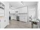 Modern kitchen with white cabinets, stainless steel appliances, and a stylish backsplash at 4531 7Th N Ave, St Petersburg, FL 33713