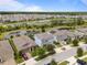 This aerial view captures the neighborhood with multiple ponds, showcasing the layout and community feel at 4770 Ballantrae Blvd, Land O Lakes, FL 34638
