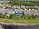 A relaxing property featuring an attractive backyard pool with a view of a nearby lake at 4770 Ballantrae Blvd, Land O Lakes, FL 34638