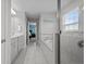 Bright bathroom showcasing a soaking tub, glass shower, and double vanity sinks at 4770 Ballantrae Blvd, Land O Lakes, FL 34638