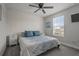 Bedroom with a paneled accent wall, large bed, and window with blinds at 4770 Ballantrae Blvd, Land O Lakes, FL 34638