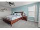 Comfortable bedroom featuring a large bed, bedside tables, and natural lighting at 4770 Ballantrae Blvd, Land O Lakes, FL 34638