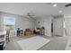 Carpeted room with a large window, desk, and decor at 4770 Ballantrae Blvd, Land O Lakes, FL 34638