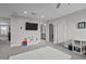 Large carpeted room with multiple doorways and a flat-screen television at 4770 Ballantrae Blvd, Land O Lakes, FL 34638