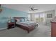 Primary bedroom with a ceiling fan, natural light, and calming blue accents at 4770 Ballantrae Blvd, Land O Lakes, FL 34638