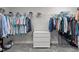 Walk-in closet with ample hanging space, shelving, and a central dresser at 4770 Ballantrae Blvd, Land O Lakes, FL 34638