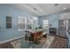 Cozy dining room with wood table, bench seating, and natural light at 4770 Ballantrae Blvd, Land O Lakes, FL 34638