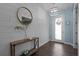 Light and airy entryway with shiplap accent wall, modern decor, and a view of the front door at 4770 Ballantrae Blvd, Land O Lakes, FL 34638