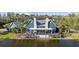Charming waterfront clubhouse with a spacious deck and scenic views of the lake at 4770 Ballantrae Blvd, Land O Lakes, FL 34638