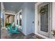 Charming front porch with inviting seating and a welcoming front door with decorative wreath detail at 4770 Ballantrae Blvd, Land O Lakes, FL 34638