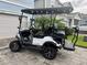 Yamaha golf cart parked in front of the home's driveway at 4770 Ballantrae Blvd, Land O Lakes, FL 34638