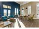 Well-lit lounge with a cozy seating area, modern furniture, and stylish light fixtures at 4770 Ballantrae Blvd, Land O Lakes, FL 34638