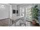 Well-lit office space with modern desk, large windows, and serene decor perfect for a productive work environment at 4770 Ballantrae Blvd, Land O Lakes, FL 34638