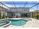 Private screened-in pool and spa with beautiful patio for outdoor entertaining at 4770 Ballantrae Blvd, Land O Lakes, FL 34638