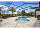Relax in this inviting screened-in pool, complete with an adjacent patio area for outdoor dining at 4770 Ballantrae Blvd, Land O Lakes, FL 34638
