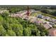 Aerial view showcasing the home's location within a community with lush surroundings and convenient access to nearby amenities at 4916 Rolling Green Dr, Wesley Chapel, FL 33543
