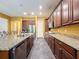 Modern kitchen featuring granite countertops, stainless steel appliances, and ample cabinet space at 4916 Rolling Green Dr, Wesley Chapel, FL 33543