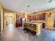 Spacious eat-in kitchen with granite counters, stainless appliances, and plenty of room for entertaining at 4916 Rolling Green Dr, Wesley Chapel, FL 33543