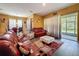 Comfortable living room with bright walls, stylish furniture, and a sliding door to the outside at 4916 Rolling Green Dr, Wesley Chapel, FL 33543