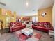 Cozy living room with neutral colors, comfortable seating, and an open floor plan at 4916 Rolling Green Dr, Wesley Chapel, FL 33543