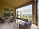Comfortable screened patio area with stylish outdoor furniture, ideal for entertaining guests at 4916 Rolling Green Dr, Wesley Chapel, FL 33543