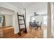 Bright dining room featuring hardwood floors and a decorative ladder at 5005 W Evelyn Dr, Tampa, FL 33609