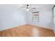 Bright bedroom features laminate floors, a ceiling fan and a window at 509 Falmouth St, Temple Terrace, FL 33617