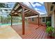 The large, covered deck has ample room for seating and is a great place to relax by the pool at 509 Falmouth St, Temple Terrace, FL 33617