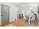 Dining area with modern lighting, a round table, and neutral decor near kitchen at 509 Falmouth St, Temple Terrace, FL 33617