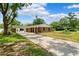 Beautiful single-story brick house with a covered entryway and long driveway at 509 Falmouth St, Temple Terrace, FL 33617