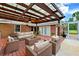 Outdoor patio area with ample seating and a ceiling fan at 509 Falmouth St, Temple Terrace, FL 33617