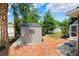 Backyard shed on a brick patio at 509 Falmouth St, Temple Terrace, FL 33617