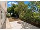 Lush backyard features green space, mature trees, and a serene atmosphere at 5122 Chet Dr, New Port Richey, FL 34652