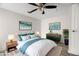 Bedroom featuring a ceiling fan, wooden floors, and a stylish bed with decor at 5122 Chet Dr, New Port Richey, FL 34652