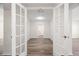 Hallway featuring French doors and wood floors at 5122 Chet Dr, New Port Richey, FL 34652