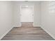 Hallway featuring wood floors and neutral walls at 5122 Chet Dr, New Port Richey, FL 34652