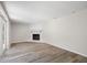 Bright living room featuring a fireplace and sliding doors to the exterior at 5122 Chet Dr, New Port Richey, FL 34652
