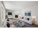 Staged living room featuring a fireplace, plush seating, and modern decor at 5122 Chet Dr, New Port Richey, FL 34652