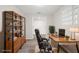 Bright home office with a desk, chair, and shelving unit to keep you organized at 5122 Chet Dr, New Port Richey, FL 34652
