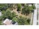 High angle of a large vacant lot with some mature trees in a residential neighborhood at 5680 77Th N Ave, Pinellas Park, FL 33781