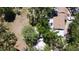 A birdseye view shows a home with backyard, mature trees and a circular spot where a pool once was at 5680 77Th N Ave, Pinellas Park, FL 33781
