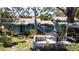 Exterior of a charming older home surrounded by mature trees at 5680 77Th N Ave, Pinellas Park, FL 33781