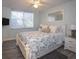 Calming bedroom with a ceiling fan, large window, and a queen-size bed at 5701 Bahia Del Mar Cir # 108, St Petersburg, FL 33715