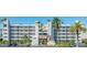Beautiful low-rise condo building featuring white balconies and lush landscaping at 5701 Bahia Del Mar Cir # 108, St Petersburg, FL 33715