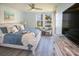 Serene main bedroom with water views, light blue bedding and coastal decor at 5701 Bahia Del Mar Cir # 108, St Petersburg, FL 33715