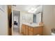 Functional bathroom featuring a wooden vanity with ample counter space at 6100 Gulfport S Blvd # 415, Gulfport, FL 33707