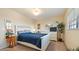 Relaxing bedroom featuring a comfortable queen bed, matching dresser with mirror, and a peaceful ambiance at 6100 Gulfport S Blvd # 415, Gulfport, FL 33707